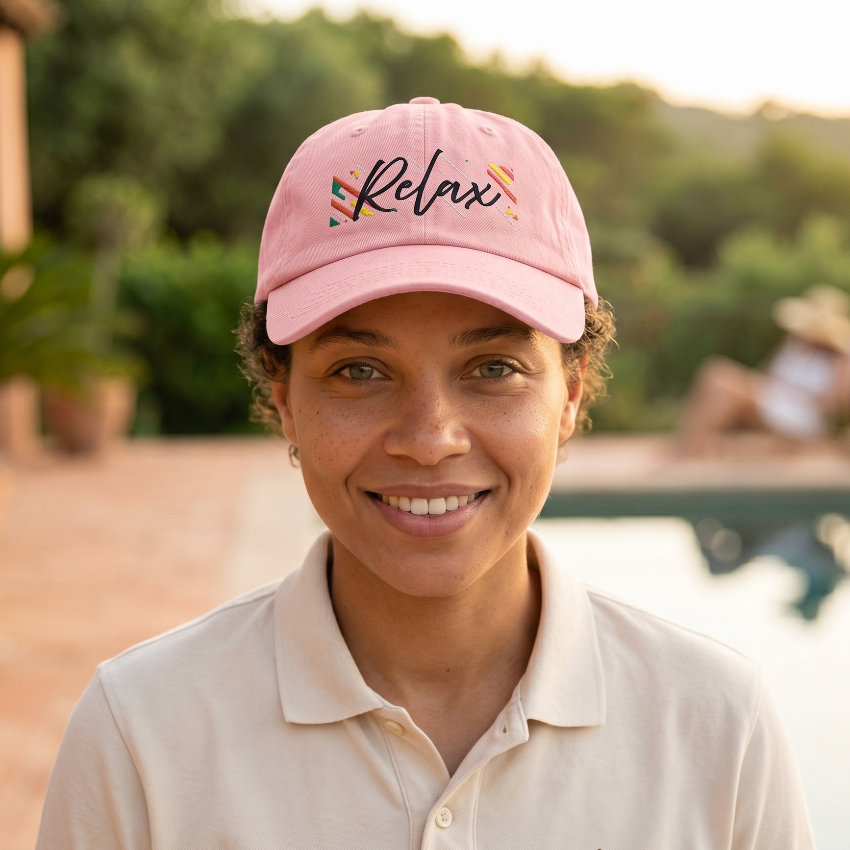 Person wearing a pink cap with 'Relax' text, standing outdoors.